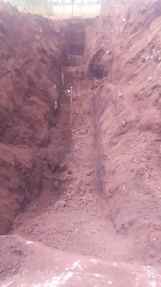 Deep excavation trench with measurement pole