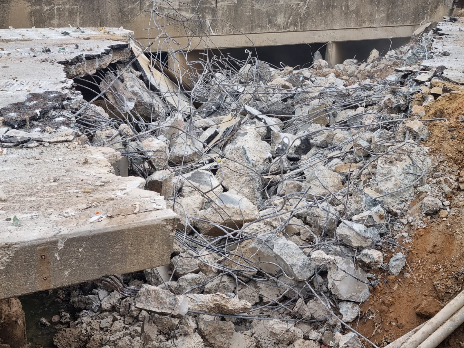 Destroyed concrete rubble and rebar debris