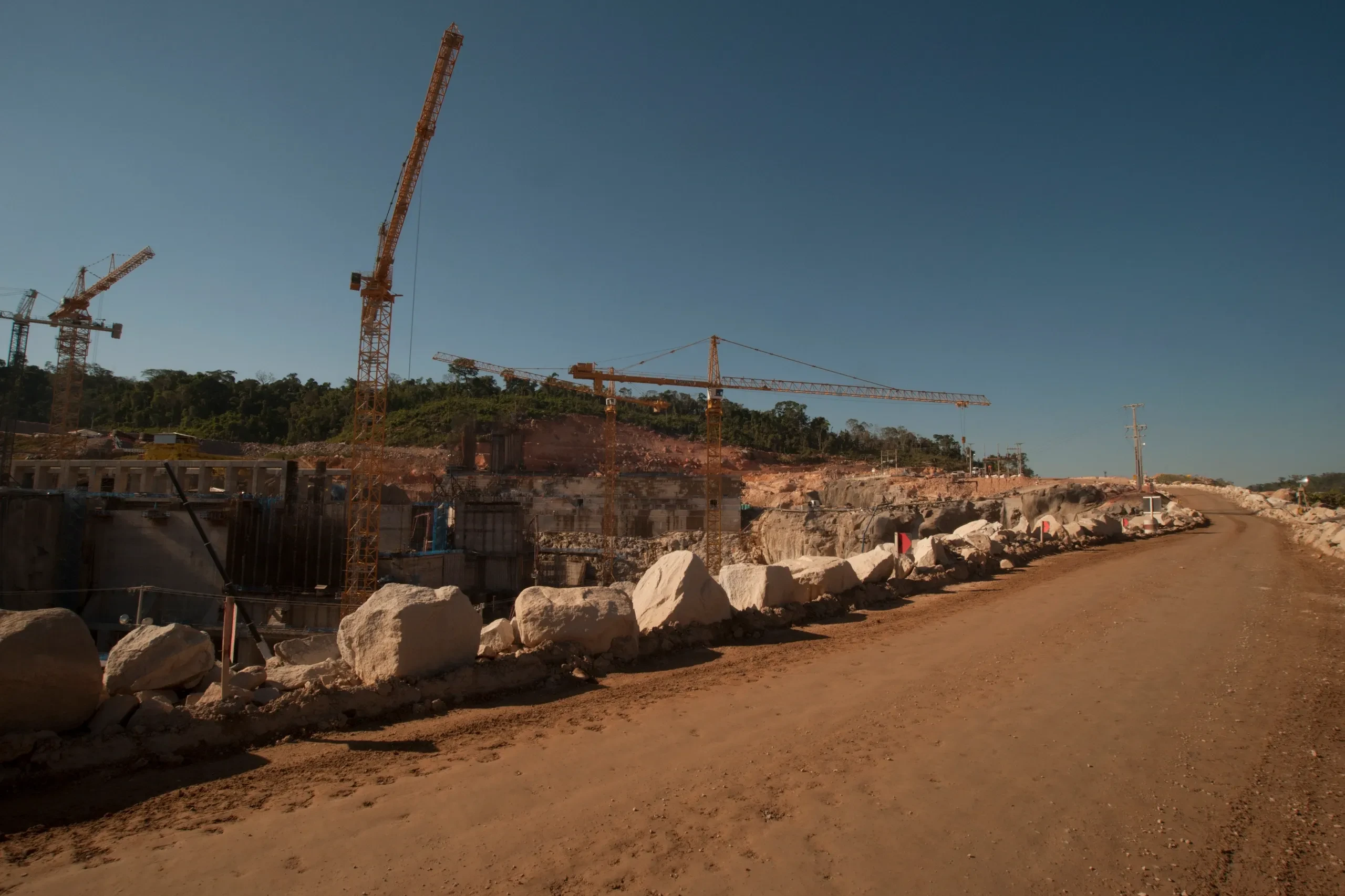 Stone quarry with construction cranes operating