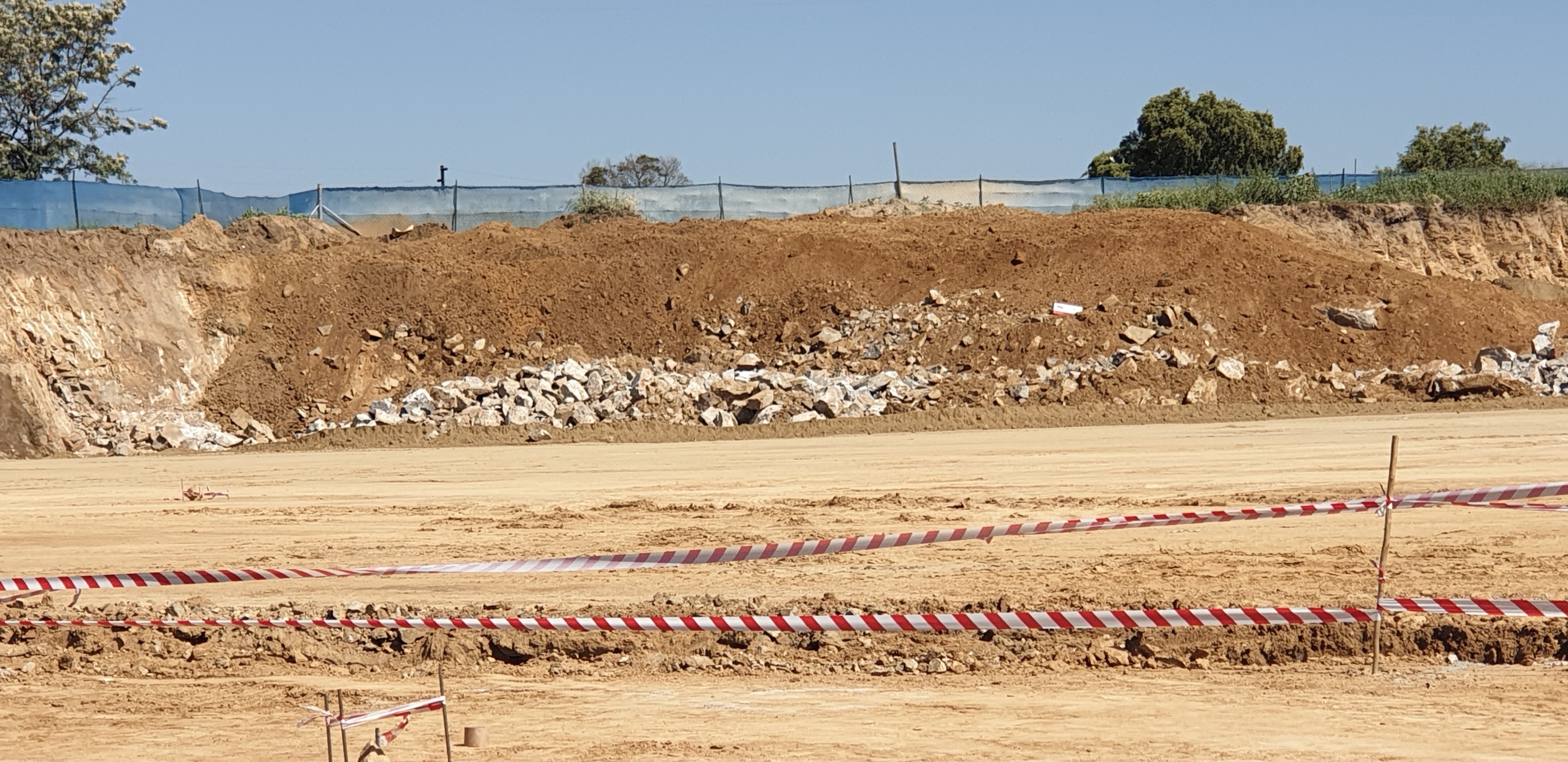 Construction site with excavated earth and debris